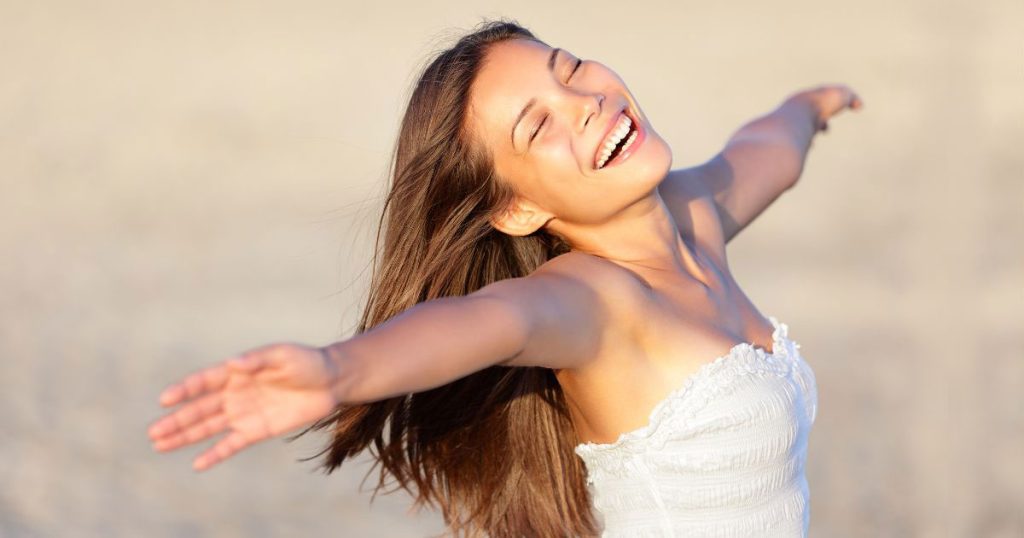 Happy woman smiling after completing NAD+ addiction treatment at Hydrate Medical in Charlotte North Carolina
